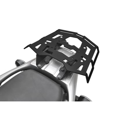 This black powdercoated luggage rack is made from 4mm thick and laser cut aluminum. It can be mounted to the original support plate to enlarge the rack's surface area. The slots for the fastening straps secure the luggage directly on the luggage rack. 