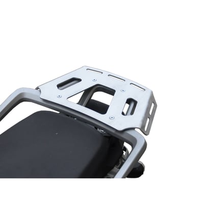 This silver powdercoated luggage rack is made from 4mm thick and laser cut aluminum. It can be mounted to the original support plate to enlarge the rack's surface area. The slots for the fastening straps secure the luggage directly on the luggage rack. 