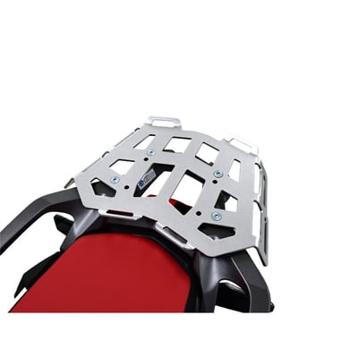 This silver powdercoated luggage rack is made from 4mm thick and laser cut aluminum. It can be mounted to the original support plate to enlarge the rack's surface area. The slots for the fastening straps secure the luggage directly on the luggage rack. 