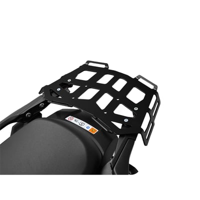 This black powdercoated luggage rack is made from 4mm thick and laser cut aluminum. It can be mounted to the original support plate to enlarge the rack's surface area. The slots for the fastening straps secure the luggage directly on the luggage rack. 