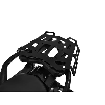 This black powdercoated luggage rack is made from 4mm thick and laser cut aluminum. It can be mounted to the original support plate to enlarge the rack's surface area. The slots for the fastening straps secure the luggage directly on the luggage rack. 