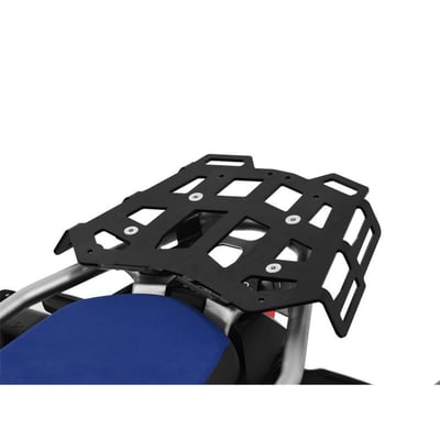 This black powdercoated luggage rack is made from 4mm thick and laser cut aluminum. It can be mounted to the original support plate to enlarge the rack's surface area. The slots for the fastening straps secure the luggage directly on the luggage rack. 