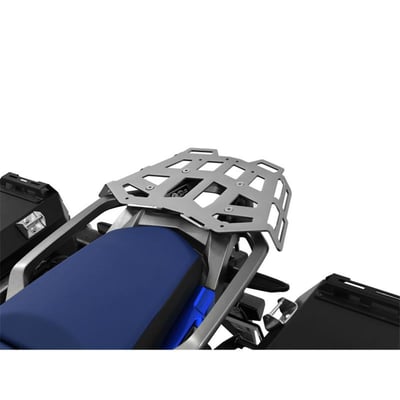 This silver powdercoated luggage rack is made from 4mm thick and laser cut aluminum. It can be mounted to the original support plate to enlarge the rack's surface area. The slots for the fastening straps secure the luggage directly on the luggage rack. 