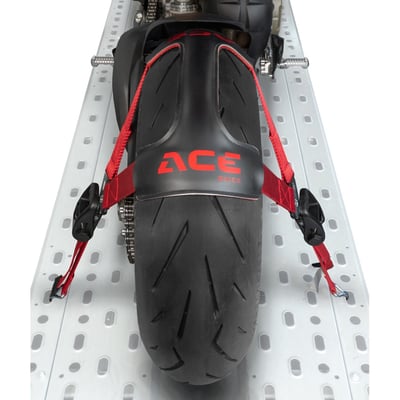 Complete with 30mm wide 65cm long tie-down straps, rachets & hooks. 
Motorcycle wheel clamp-down system for transport. Used to clamp down the wheels with tie-downs, instead of attaching regular tie-downs to various places on the bike. Will fit all wheel sizes from the smallest Monkey bike to custom motorcycles with extreme wheel sizes. Tyrefix® is a small foldable design and made of polyester. Quick and easy to deploy, easy to store. Comes with special anti-slip friction material. Packed in a carrying case. Lashing capacity 500 daN (509kg-force). Net weight 1kg. 