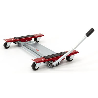 Motorcycle dolly used to effortlessly move your motorcycle around in tight spaces of garages and sheds. Rolls on four 65mm 360° rotatable swivel wheels. The Bike-A-Side Motor Mover is simply placed under the bike. Park the bike with the center stand on the dolly and then, by using a hand operated lever, the rear side of the bike is lifted off the ground and can be moved around. Zinc plated steel. Works with up to 450kg motorcycles. Dimensions: 49cm x 85cm x 10cm. Net weight 16.5kg.