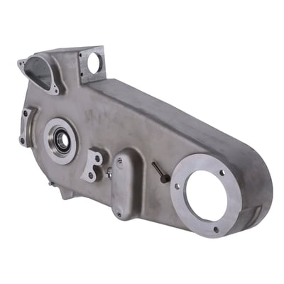 Natural cast finish. 
OEM style reproduction replacement aluminum inner primary cover with OEM style cast finish. 
Complete with pre-installed mainshaft support bearing and inner chain adjuster detent plate. 
Complete as shown. 
OEM replacement reference 60617-65A. 
Note: Sand cast for strength. 
Note: This cast inner primary cover is slightly larger than die-cast replacements. Installer can machine or polish down the edges for a perfect match. 
Installation note: Use with shorter front chain oiler. Cover is cast and thicker than stock, so check clearance between cover and frame during installation. 