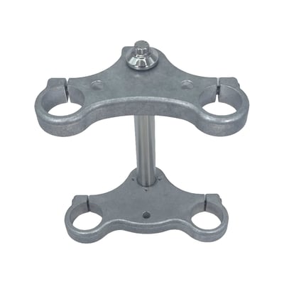 For use with 41mm diameter fork tubes. 
Gloss black powder coated. 
This is the ORIGINAL, but improved, Bare Knuckle Performance Super Narrow triple tree kit. These Super Narrow trees are 1" (2.54mm) narrower than a stock Narrow Glide with 6" (152.4mm) center to center distance of tubes, rather than 7" (177.8mm). Comes complete with steering stem, tapered flange washer, and an ARP stem bolt. 
- Great for building a classic Super Narrow bike 
- With integral steering stop mount holes 
- Drilled and counter bored for 3/8" headlight bolt 
- Drilled and counter bored for 1/2" riser bolts 
- Traditional 3-1/2" (8.9cm) riser bolt spacing 
- With wheel axle 
- Includes all required installation hardware. 
The required 1" diameter Super Narrow stainless wheel axle is included and offers great and lasting custom looks. Made from 17-4 series polished stainless steel, which offers sheer and tensile strength comparable to that of chromoly with superior corrosion resistance. Axle will not bend or break. Comes with a high quality 12-point stainless steel nut and custom tapered washer. Nut is secured by a stainless steel e-ring. 
Note: Axle and nut must be 100% clean before installation and coated with provided anti-seize (Loctite LB8012). This includes 'test fitting / hand tightening'. Cleaning axle, threads and anti-seize coating remains applicable when reinstalling after servicing wheel. 