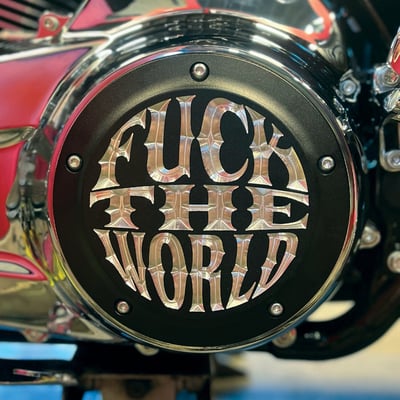 7.75" diameter. 
Matte black with clear etched logo. 
Manufactured from precision-detail CNC machined aluminum. 
With the 'Fuck The World' logo prominently CNC etched allowing the Indian Larry freedom vibe to resonate in this original Indian Larry clutch cover. 
