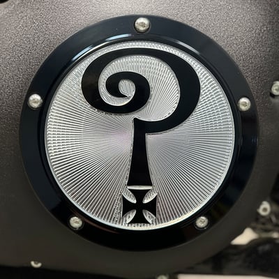7.25" diameter. 
Gloss black with clear etched logo. 
Manufactured from precision-detail CNC machined aluminum. 
The Question Mark with Larry's classic CNC etched 'Question Everything' logo. 
This is where Heritage, Style and Freedom come together in the original and one of a kind Indian Larry clutch cover. 