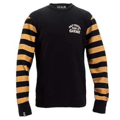 The Holy Freedom Clockwork sweatshirt is made from 100% brushed cotton with a crewneck cut and raw fabric edges for a bold, lived-in look. Windproof lining at the front and reinforced elbows add function to form, while water-based prints on the chest and sleeves keep it breathable and authentic. Built for the ride, ready for anything.