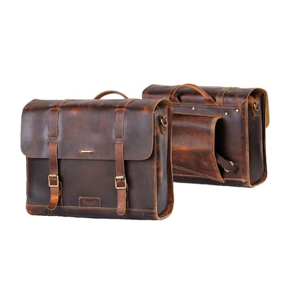 - Crafted to fit the Triumph Bonneville series, Royal Enfield Super Meteor 650, Shotgun 650 & Meteor 350
- For use on H-D or other bikes in custom applications
- Set of 2 bags with leather straps
- Made from 100% premium 2.2 mm thick hard waxed heavy-duty leather
- Complete with rain cover
- Includes leather shoulder strap (for off bike use), custom mounts, and a rain cover
- Capacity 13 liters per bag
- Dimensions: 34cm x 27cm x 14cm.
Note: A model specific matching 'saddle stay' (708437, 708440, 708438, 708439) is sold separately. It is available for various Triumph & Royal Enfield models allowing an easy installation to the bike.
