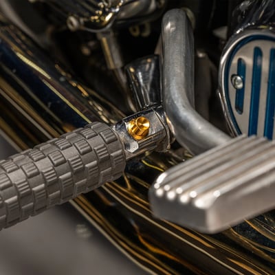 Gold anodized finish. 
12-point CNC machined from solid titanium. Reduced weight when compared to steel or stainless. Excellent corrosion resistant. 