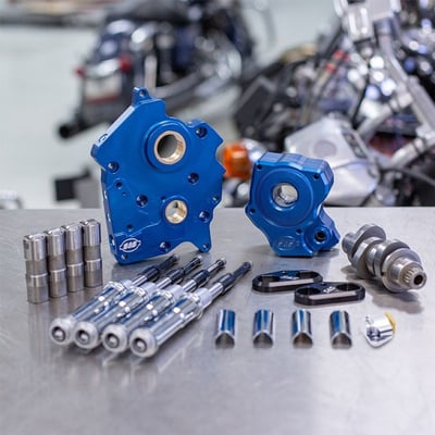 Oil Pump/Cam Plate

Precision Machined from Billet Aluminum
Blue Anodized Finish
Passage Plugs Removeable for servicing
Independant Scavenge Sections for Flywheel Cavity and Cam Chest
Debris Screens in both scavenge pickups
Magnet in Cam Chest to help to stop debris from entering oil pump
Increased Flow Capacity on both Feed and Scavenge side
Adjustable Pressure Relief Valve is adjustable with unit installed in engine
Pushrods:

Quickee Pushrods
Chrome pushrod tubes available
Tappets:

S&S Precision Tappets
Tappet Cuffs:

Hard Anodized Black Coating
Billet Aluminum Construction
Stronger than Stock Material eliminates Distortion
Improve tappet stability in high lift and high rpm situations
Cam:

465 is a Torque Cam, perfect for Touring applications
Includes all gaskets, bearings, and hardware required for installation
MADE IN USA