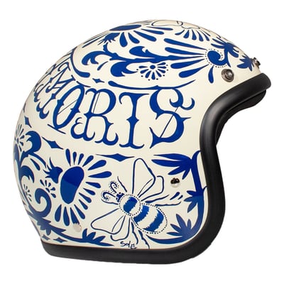 Embrace the fusion of classic style and modern functionality with the DMD Retro helmet, a nod to the iconic 70's design. This helmet isn't just a protective gear but a statement piece, crafted for those who dare to stand out. With its ECE 22.06 approved fiberglass shell available in three sizes, it offers a snug fit. The helmet is bluetooth ready, features integrated snaps for visors, and boasts a luxurious, washable lining with Velcro for a custom fit. Secured with a padded chin strap and a reliable Double D-ring closure, this helmet is the perfect blend of vintage charm and contemporary comfort.