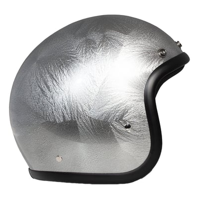 Embrace the fusion of classic style and modern functionality with the DMD Retro helmet, a nod to the iconic 70's design. This helmet isn't just a protective gear but a statement piece, crafted for those who dare to stand out. With its ECE 22.06 approved fiberglass shell available in three sizes, it offers a snug fit. The helmet is bluetooth ready, features integrated snaps for visors, and boasts a luxurious, washable lining with Velcro for a custom fit. Secured with a padded chin strap and a reliable Double D-ring closure, this helmet is the perfect blend of vintage charm and contemporary comfort.