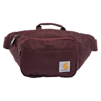 This Carhartt Waist pack is a no-fuss bag dedicated to the small essentials. It has just enough room for your phone, cash, keys, and maybe a small snack or two. The water-repellent material helps your things stay dry through light rain.

• Rain Defender™ - Durable Water repellent finish
• Long webbing belt with side release buckle
• Zipper secured front compartment with key fob
• Large main compartment with zipper secured mesh pocket
• Two exterior loops
• Carhartt label on front
• Woven
• 600 Denier DWR Polyester
• 100% Polyester