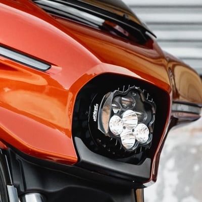 Plug & Play ECE, DOT-compliant performance LED headlamp.
The Shark Demon® 2 headlamp Kit offers high-performance illumination, specialized for motorcycle on road use. ECE, DOT compliant design with unmatched beam pattern and durability. Low beam projects 3600 raw/2651 effective lumens from three projection-style LEDs. High beam adds four additional direct-reflective LEDs boasting an impressive 9080 raw/4485 effective lumens total. Single lamp assembly is completely sealed IP67, waterproof with clear polycarbonate lens and gloss black aluminum housing. 3mm, 304 gloss black stainless steel mounting bracket offers OEM style headlight adjustability for proper aiming. Includes Plug and Play wire harness and mounting hardware for direct OEM replacement installation.