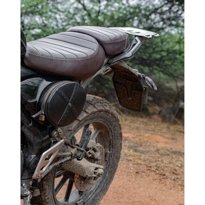 The Scrambler Egg is a compact leather pocket that replaces the stock oval side panel. It mounts directly onto a custom steel plate, ensuring a flush, secure fit that maintains the bike’s clean factory lines while adding much-needed utility.
• crafted to fit the triumph scrambler 400x/xc
• replaces the stock left side panel with a functional, clean mounting solution
• comes with a custom-shaped steel plate for a seamless, factory-like fit
• 100% handmade, built to last through years of use and abuse
• compact space designed for real essentials - papers, tools, snacks
• bright yellow lycra lining for better visibility inside the bag