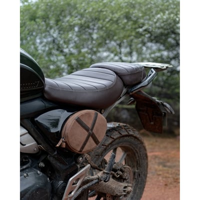 The Scrambler Egg is a compact leather pocket that replaces the stock oval side panel. It mounts directly onto a custom steel plate, ensuring a flush, secure fit that maintains the bike’s clean factory lines while adding much-needed utility.
• crafted to fit the triumph scrambler 400x/xc
• replaces the stock left side panel with a functional, clean mounting solution
• comes with a custom-shaped steel plate for a seamless, factory-like fit
• 100% handmade, built to last through years of use and abuse
• compact space designed for real essentials - papers, tools, snacks
• bright yellow lycra lining for better visibility inside the bag