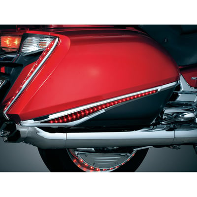 Stylish, functional and very unique, these will transform your new wing into something out of this world. Conforming to the lines of the stock saddlebags, these accents bridge the gap between the textured black and painted bodywork. Chrome with Red Lenses, with super bright L.E.D.'s operating as running lights and turn signals. Plug-&-play wiring installation.
- Red lenses