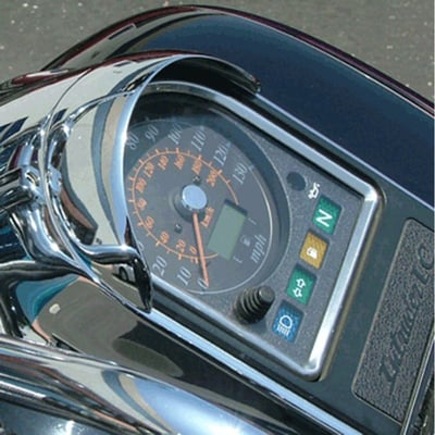 Attaches to tank-mounted speedometers. This half-mooned visor, made of cast metal, blocks the sun's glare from the speedometer glass to make it easier to read the speedometer. The visor has a quality chrome finish. It secures with a self adhesive tape.
