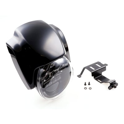 Unpainted gloss black finish. Includes a custom LED headlamp, the OEM headlamp is not re-used. The custom headlamp remains adjustable, like OEM. Kit comes with a matte black powder coated CNC laser-cut steel bracket and a high quality ABS plastic mask. Provides a more aggressive look and optically makes the bike lower & longer. Mount holes are pre-drilled and installation is bolt-on to OEM mounting points and compatible with OEM cables and wiring. This comes with approval.
Note: No modifications required for installation but the LED headlamp must be soldered to the wiring harness of the original headlamp, connector is different.
Note: Check your local MCS dealer or the MCS sales department for exact type of approval and validity on bike model and years on the test report.