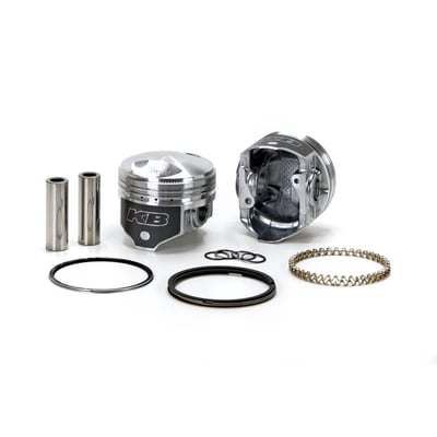 High compression pop-up piston set. 9.5:1 CR. Piston weight 388gr. Piston pin weight 97gr. 
Head type: Dome / Dome -47cc. 
Compression height 1.285" / Bore 3.4980". 
Stroke 4.250". 
Rod length 7.440" / Cyl. length 5.330". 
Comes with T6 heat treated 390 Hypereutectic cast pistons with 16% silicone levels which enables running a very tight clearance for longevity and hardly any piston noise. 

Note: Top compression ring will need additional clearance. See instructions.
Note: Around 30% of stock 1340cc Shovel cylinders may present a problem in combination with the location of some of the oil return holes since KB pistons have a wider piston ring pack for better piston stability in the cylinder. In these cases the oil return hole must be re-located (lowered) to avoid excessive oil consumption.