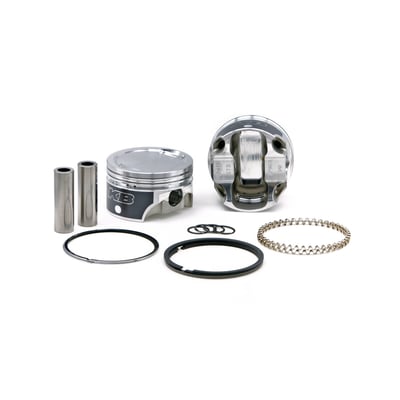 883-1200 conversion forged piston set. 10.1 CR with 51cc head. Works with unmodified 883 heads.
Piston weight 337gr. 
Piston pin weight 97gr. 
Piston pin dia. .791" / offset. 
Head type: Dish with +9.8cc. 
Compression height 1.280". 
Bore 3.498". 
Stroke 3.812". 
Rod length 6.926". 
Cyl. length 4.650". 
All KB forged pistons are made from 4032 alloy, a 11% silicon alloy that is formed in a forging press. Forging aluminum gives a superior strength and structural integrity on a molecular level, after which it is fully machined. The combination of this alloy and the forging process allows the piston to flex under detonation, or pre-ignition, giving the best resistance to cracking. Although 4032 has a low expansion rate, it is higher than the cast Hypereutectic. Therefore forged KB pistons will require about .001" wider piston to wall clearance. Pistons are sold as sets, complete with wrist pin retaining rings, wrist pins and piston rings.
Please note that all KB forged pistons come equipped with offset wrist pins / piston pins. There is a front and rear section on the piston and it is necessary to install it in the correct way. Please refer to the installation instructions, as provided with each piston set, prior to installation.

Note: For 04-up XL models 1200cc cylinders must be used. The stock 04-up 883 cylinder liners are too thin for boring to 1200 size.