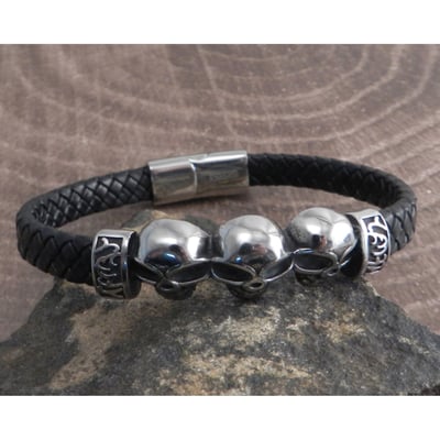 For the guy or girl who is packing attitude, this jewelry collection from AMiGAZ is made for you. A three skull heads on leather braid bracelet. This stunner skull style Stainless Steel bracelet has a magnetic lock clasp. Leather is 12 x 4 mm made to fit 8" wrist. Bold, rugged, and eye-catching with details that are bound to set you apart from the crowd, you'll love the way a simple piece of jewelry can elevate your look and your mood. 