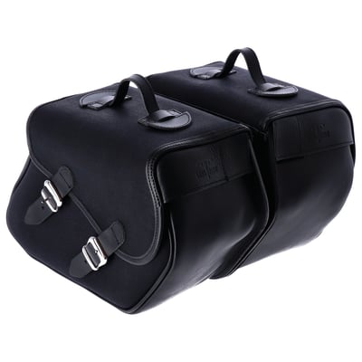 Longride Heritage saddlebags only without mounting brackets. 
Contains two small quick release waxed cotton saddlebags that are finished with ranger leather straps. 
Internal reinforcement plates help maintain its shape. 
The bags will not look bulky but are still large enough to hold the extra gear you need for a day trip. 
Designed to be used with model specific or universal 'Click & Lock' Longride saddlebag brackets. 
The low profile carrying handle is perfect for off-bike use. 
The Click & lock system makes it easy to remove the bag from your bike and carry your gear with you or into house, motel or tent. Manufactured from waxed cotton material with genuine Ranger Leather. 
Approx. dimensions: 38cm x 30cm x 17cm. 
Approx. capacity 23 liters per pair. 
Sold in pairs. 
Note: Universal 986406/986407 or a model specific saddlebag bracket is required for on-bike mounting and sold separately. 
Note: Some models will require turn signals relocated to the rear of the fenders struts.