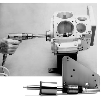 Used to lap pinion bearing race in the right crankcase. Removes more material in less time but with greater accuracy than a conventional lap. The JIMS case lap is guided on both sides of the pinion bearing race. This additional support on the cam gear side of the bearing race is achieved by means of a bolt on the base plate that precisely locates a drill bushing in which the lap turns. This base plate is located on the same engine case pins as the cam cover. The positioning of this drill bushing is held within .0002" to the engine case pins and within .0002" of the case centerline.
Now, instead of guiding only from the left side with Timken bearings, which are a floating fit, the JIMS case lap uses a special ground bearing sleeve to hold the left side of the lapping shaft without movement. Both ends of the lap are supported precisely in the same centerline as the flywheel assembly.
With this extreme rigid arrangement it is possible to power the lap with a low speed drill motor without fear of chatter in the lapped bearing race. The JIMS lap can still be powered by the conventional hand crank when desired. It is recommended to use JIMS 978341 (snap ring installer & remover tool), especially on 90-99 crankcases. 
Note: See 978412 vor the replacement 1-3/4" O.D. lap head