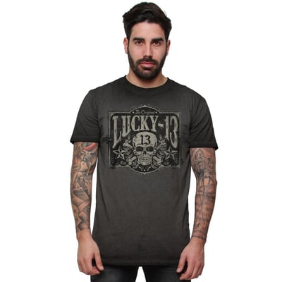 The "tombstone" short sleeve men's tee is a 100% cotton vintage washed tee. There is a full front print of the classic "tombstone" logo.