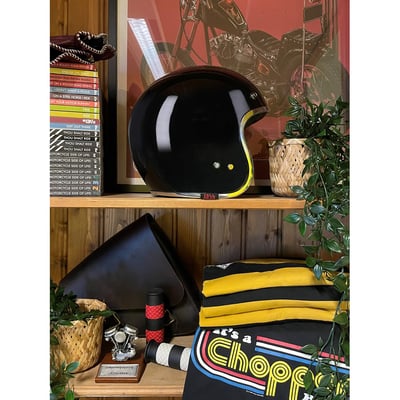 The best way to stay safe on a motorcycle is to not ride a motorcycle, but let’s skip that option and go for an ECE 22.06 approved helmet that looks amazing. These 13 ½ Skull bucket helmets are old-school cool, with vintage colors and graphics that match your chopper style. The Buckets are made of fiberglass in four different shells and are available in sizes ranging from Extra Small to Double XL. Complete with padded chin strap and classic double d-ring closure, plus integrated snaps for shields and peaks like the Scum. As some of the smallest helmets on the market, you are assured to not look like Tweety on your bike.
Don't miss this chance to get your own 13andahalf Skull Bucket and "Get to The Chopper"!
