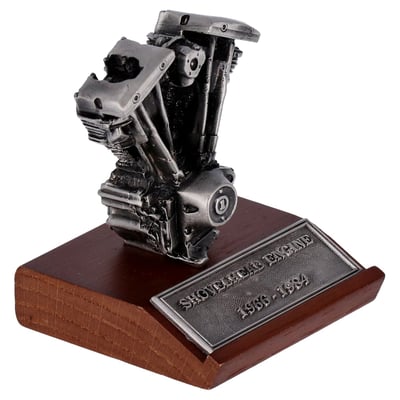 Featuring pewter construction on a wooden display base. Model measures 2-3/4" x 2-3/4" at the base. The overall height including the motor measures 3-1/2". The overall height of the Shovelhead motor is 2-5/8". Width of the motor is 2-1/4".