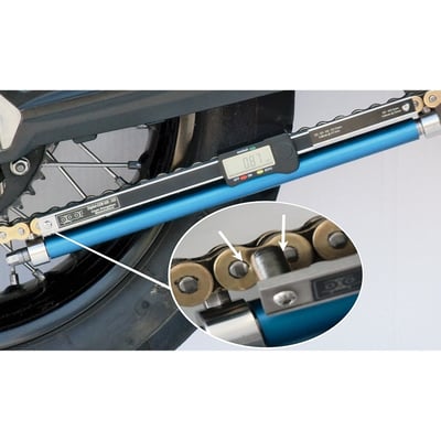 This is a digital-CEM 'Chain Stretch Measuring Tool', a system which lets you measure chain stretch, enabling you to determine the exact percentage of chain wear. This way you can decide if chain replacement is required, or not. The system works by digitally measuring the total length of 20 chain links. Works on all 400 series (420 & 428 chains) and 500 series (520, 525, 530 & 532 chains). Includes the digital measuring device, tensioning device, a calibration gauge and a line laser.