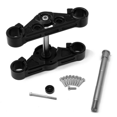 Take a ride on the wide side with this billet aluminum lightweight triple tree set. Compatible with tires up to 180mm and comes in a gloss black anodized finish. Used with stock 49mm fork tubes. Rake is stock for non-compromised handling. Sleek design and perfect to transform your M8 Softail, especially in combination with an optional fork cover set, to a bike that has a presence. Set includes triple trees, a zinc plated 25mm thick extra wide wheel axle and hardware. OEM frame neck bearings can be reused. 
Note: Not compatible with Softails with upside down / inverted forks. 
Note: Fitment checks are always advised before painting and final assembly. 