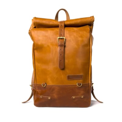 The Trip Machine Backpack pannier is built for adventure. Made completely from 100% heavy-duty veg tan leather, it is made for years of use and abuse and gets better with every adventure. Designed to be easily mounted on or off the motorcycle in a matter of seconds. A backpack for everyday adventure. The classic roll-top design provides flexibility, 14-15L, and ensures that your valuables are safe. The perfect bag for the daily grind and the occasional adventure.