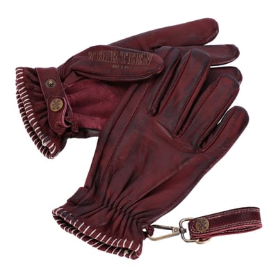 Embark on a journey with the 13 1/2 Loud Ride gloves – where rugged charm meets timeless allure in a symphony of craftsmanship and style. Inspired by the legendary designs, these gloves are more than just accessories; they're a statement of rebellion and individuality. The gloves are made from the finest full grain cowhide and CE approved, each pair is gonna tell a story of adventure and grit, with a distressed, vintage look that only improves with age. Picture yourself on the open road, the wind in your hair, and these gloves, your faithful companion, growing more distinctive and beautiful with every mile. And when the journey pauses for a moment of respite, let the brass and leather clip keep your gloves close at hand, a reminder of the adventures that await. 