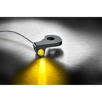 1.5W, 1 LED. An inconspicuous install below the handlebar and approved for front use. Hard to spot once installed but street legal. In busy traffic it is important that turn signals are actually seen, this is where the Kellermann power LEDs shine... they are spectacularly bright so you will not be overlooked. Apart from the power LEDs a sophisticated system of lenses and reflectors, called EXtranz® (Extreme Optical Transparency technology), is used. Installation is bolt-on and all electronics of the Dash turn signals are inside the turn signal housing, for easy connecting to the 12 volt system. 
- Sensationally small, spectacularly bright 
- EXtranz® - Extreme Optical Transparency Technology 
- Kellermann HighPower LED Technology 
- Longlife Protection Guard®, IC operated, 330 kHz 
- Black quality metal housing with tinted lens 
- Suitable for 12 volt DC applications 
- European design protection 
- Approved for front use. 
Note: Electronic equipment may be required to regulate flash rate (see 996466 Kellermann i.Nex equalizer for an easy turn signal, tail/brake lights and position lights installation solution) 