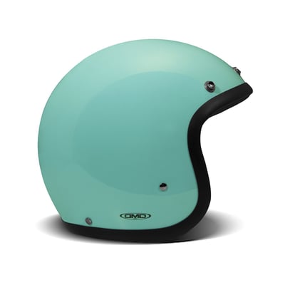 Embrace the fusion of classic style and modern functionality with the DMD Retro helmet, a nod to the iconic 70's design. This helmet isn't just a protective gear but a statement piece, crafted for those who dare to stand out. With its ECE 22.06 approved fiberglass shell available in three sizes, it offers a snug fit. The helmet is bluetooth ready, features integrated snaps for visors, and boasts a luxurious, washable lining with Velcro for a custom fit. Secured with a padded chin strap and a reliable Double D-ring closure, this helmet is the perfect blend of vintage charm and contemporary comfort.