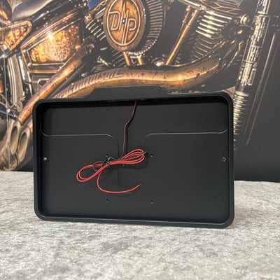 With built-in top side mounted E approved LED license plate light. Tidy tail made simple! – The license plate frame is mounted to your existing bracket, or one of the DMP license plate brackets/holders for the cleanest look. Then you slide your license plate in from the bottom. The plate locks with the small screws from the back (included). Danish Motorcycle Parts (DMP) milled this frame from a single piece of billet aluminum for strength and lightweight, it's powder coated for durable and lasting beauty. Universal fit and will install to most motorcycles. - With E marked LED license plate light